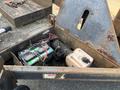 A 2013 JLG Industries 1014 showcasing its battery compartment featuring a battery and engine components