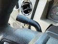 Close-up of the interior controls of a 2009 Ford F-550 focusing on the turn signal lever and dashboard elements