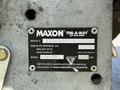 Black metal plate with white text displaying serial number capacity and model information for a Maxon Tuk-A-Way lift gate series