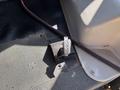 A 2017 Chevrolet Express engine start switch mounted on a black surface with red and gray trim