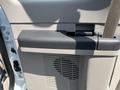 A close-up of the interior door panel of a 2008 Ford F-450 SD showing storage compartment and air vent details