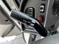 Close-up of the control lever in a 2010 Freightliner M2 106 with labeled settings for off, push, pull, and flash functions