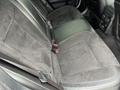 Rear seats of a 2022 Dodge Charger featuring black suede and leather upholstery with seat belts and a sophisticated design
