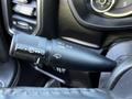 A close-up of a turn signal and windshield wiper control stalk from a 2022 RAM 3500 showing various settings and symbols for operation