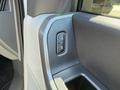 A close-up of the door lock control panel on a 2023 Ford F-550 featuring a button with a lock and unlock symbol
