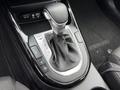 Close-up of the gear shift of a 2021 Kia Forte showing the gear positions P R N D and buttons for different settings