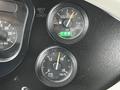 Dashboard of a 2015 Spartan School Bus showing gauges for fuel level and voltage along with a warning indicator labeled "WAIT TO START"