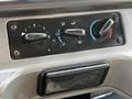 Control panel of a 2004 Freightliner M2 featuring dials for temperature and ventilation settings