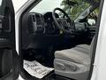 Interior view of a 2018 GMC Sierra 1500 showing the dashboard steering wheel and front seats with a floor mat that says Thank You