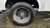 A close-up of a tire and wheel from a 2007 Ford F-550 showcasing the tread and metallic rim