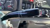 A close-up of the windshield wiper control stalk from a 2006 Ford LCF 550 with settings for mist off and intermittent wiper speeds