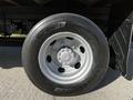 Close-up of a silver wheel and tire of a 2017 Hino 155 showcasing a detailed view of the tread and rim