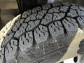 Close-up of a large off-road tire from a 2017 RAM Promaster featuring deep treads designed for enhanced grip and traction