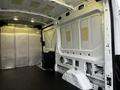 Interior of a 2017 Ford Transit van showing the cargo area with bare metal walls and a simple floor design