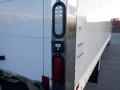 The image shows the rear corner of a 2014 International Durastar truck with a red and white taillight assembly and a reflective light fixture