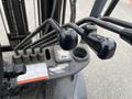 Close-up of the control levers and dashboard of a 2011 Toyota Forklift showcasing the operational features and gauge displays