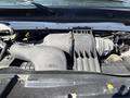 Engine compartment of a 2011 Ford Econoline featuring a large air intake and various engine components visible in the foreground