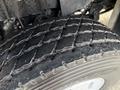 Close-up of a tire on a 2011 International WorkStar showing detailed tread patterns and rubber texture