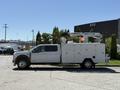 2024 Ford F-550 Super Duty truck designed for utility work featuring a white body aerial lift and storage compartments