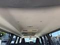 Interior view of a 2021 Chevrolet Express showing the ceiling with overhead lights and ventilation grilles