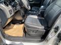 Interior of a 2006 Land Rover LR3 showing the driver's seat and dashboard with black leather upholstery and a tan floor mat