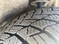 Close-up of a tire tread showing deep grooves and patterns designed for traction on various surfaces
