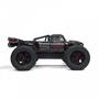 A black Arrma 1/5 Outcast 8S EXB AVC 4X4 RTR Brushless Stunt Truck with large tires and a detailed body design featuring the Arrma logo