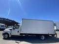 White 2014 International TerraStar box truck with a large cargo area viewed from the side