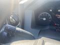 The image shows the steering wheel controls of a 2014 Ford F-250 SD with a turn signal lever and instrument cluster dials visible