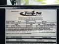 A 2009 Ford F-550 vehicle information sticker detailing specifications and manufacturing details