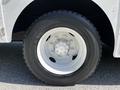 Close-up of a white wheel and tire from a 2009 Morgan Olson Workhorse vehicle