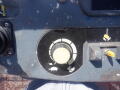 Control panel of a 2008 JLG Boom Lift featuring various dials and symbols indicating operational functions and settings