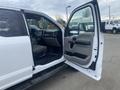 2017 Ford F-550 with an open driver's side door showcasing the interior dashboard and seats