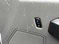 An interior view of a 2016 Ford F-150 showing a textured gray panel with a power lock button and speaker grille