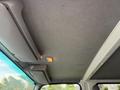 Interior view of a 2015 Isuzu NPR HD showing the ceiling and an overhead light