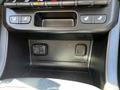 A 2021 Chevrolet Colorado center console featuring controls for seat heating and a USB port