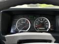 Dashboard of a 2016 Isuzu NQR showing speedometer fuel gauge and digital display with engine RPM and gear indicator