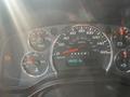 Dashboard of a 2013 Chevrolet Express showing speedometer fuel gauge and warning light indicators