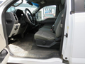 Interior of a 2017 Ford F-250 SD featuring a driver's seat and steering wheel with gray fabric upholstery and a rubber floor mat