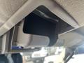 Interior view of a 2013 Ford Expedition showing an open overhead storage compartment