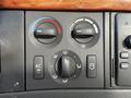 Controls for air conditioning and ventilation in a 2005 Volvo VND 122 dashboard featuring knobs and buttons for temperature and airflow settings