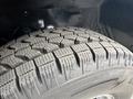 A close-up view of a tire showing detailed tread patterns designed for traction and grip on various surfaces