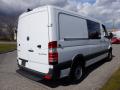 A 2016 Mercedes-Benz Sprinter van in white with a cargo area and rear doors visible, featuring a clean design and black accents on the bumper and wheels