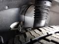 Close-up of a 2016 Mercedes-Benz Sprinter's undercarriage showing a rubber boot and part of the tire tread