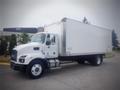 A 2021 Mack MD truck with a white boxy cargo area and a prominent cab, featuring large wheels and side mirrors