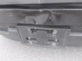 A 2015 Chevrolet Silverado 1500 with a damaged rear bumper and an empty license plate holder