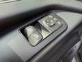 Close-up of the control panel for window adjustments and side mirrors in a 2019 Mercedes-Benz Sprinter