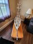 1974 model sailboat with intricate rigging and a detailed hull displayed on a wooden table