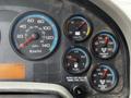 Dashboard of a 2011 International 4400 showing speedometer fuel gauge voltmeter and air pressure gauges