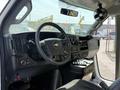 Interior of a 2020 Chevrolet Express showing the steering wheel dashboard and controls
